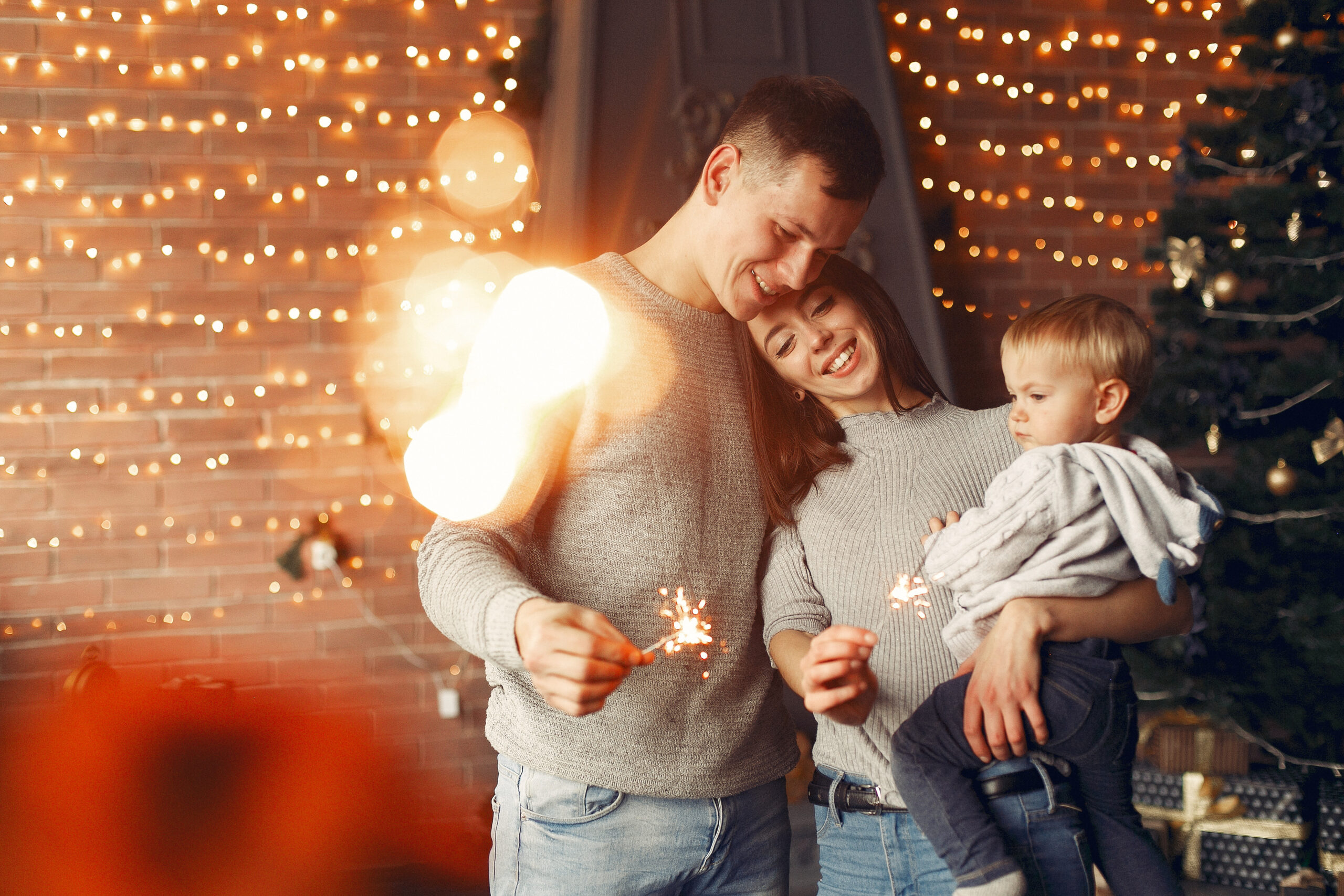 family-at-home-near-christmas-tree-scaled-1.jpg